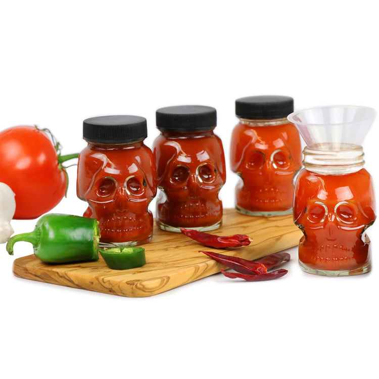 diy hot sauce kit with skull bottles and funnel